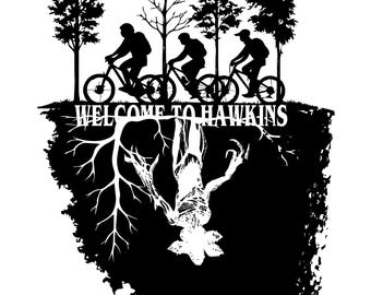 May include: A black and white graphic showing three cyclists on bikes above the text "WELCOME TO HAWKINS." Beneath, an inverted monster is displayed. The design incorporates trees and a detailed, upside-down landscape.