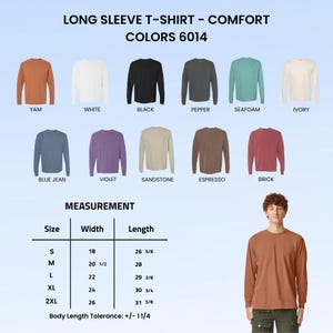 May include: A collection of long sleeve t-shirts in eleven colors including yam, white, black, pepper, seafoam, ivory, blue jean, violet, sandstone, espresso, and brick. A size chart displays width and length measurements in inches for sizes S to 2XL.