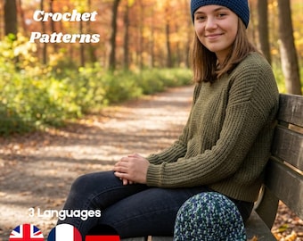 May include: A dark blue crochet beanie worn on the head and a multi-colored blue and green crochet beanie resting on a wooden bench. The text "DIY Crochet Patterns" and "3 Languages" is visible along with icons of the UK, French, and German flags.