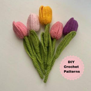 May include: A bouquet of handmade crochet tulips in shades of pink, yellow, and purple, with green stems and leaves. The text "DIY Crochet Patterns" is in a pink circle.