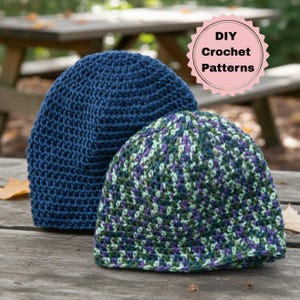May include: Two handmade crochet beanies. One is a solid navy blue, and the other is a mix of green, purple, and white yarn. The beanies are displayed on a wooden surface. A pink and white circular graphic reads "DIY Crochet Patterns".