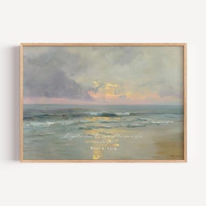 May include: A framed print of a seascape painting. The artwork depicts a beach scene with waves, a cloudy sky, and a sunset. The text "Mightier than the waves of the sea is His love for you. Psalm 93:4" is written on the print.