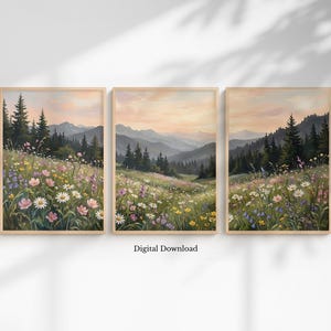 Puede incluir: Conjunto de tres impresiones artísticas enmarcadas de paisajes. Cada impresión muestra un prado lleno de flores silvestres, con un telón de fondo de montañas y un cielo de atardecer. El texto "Digital Download" está en la parte inferior.