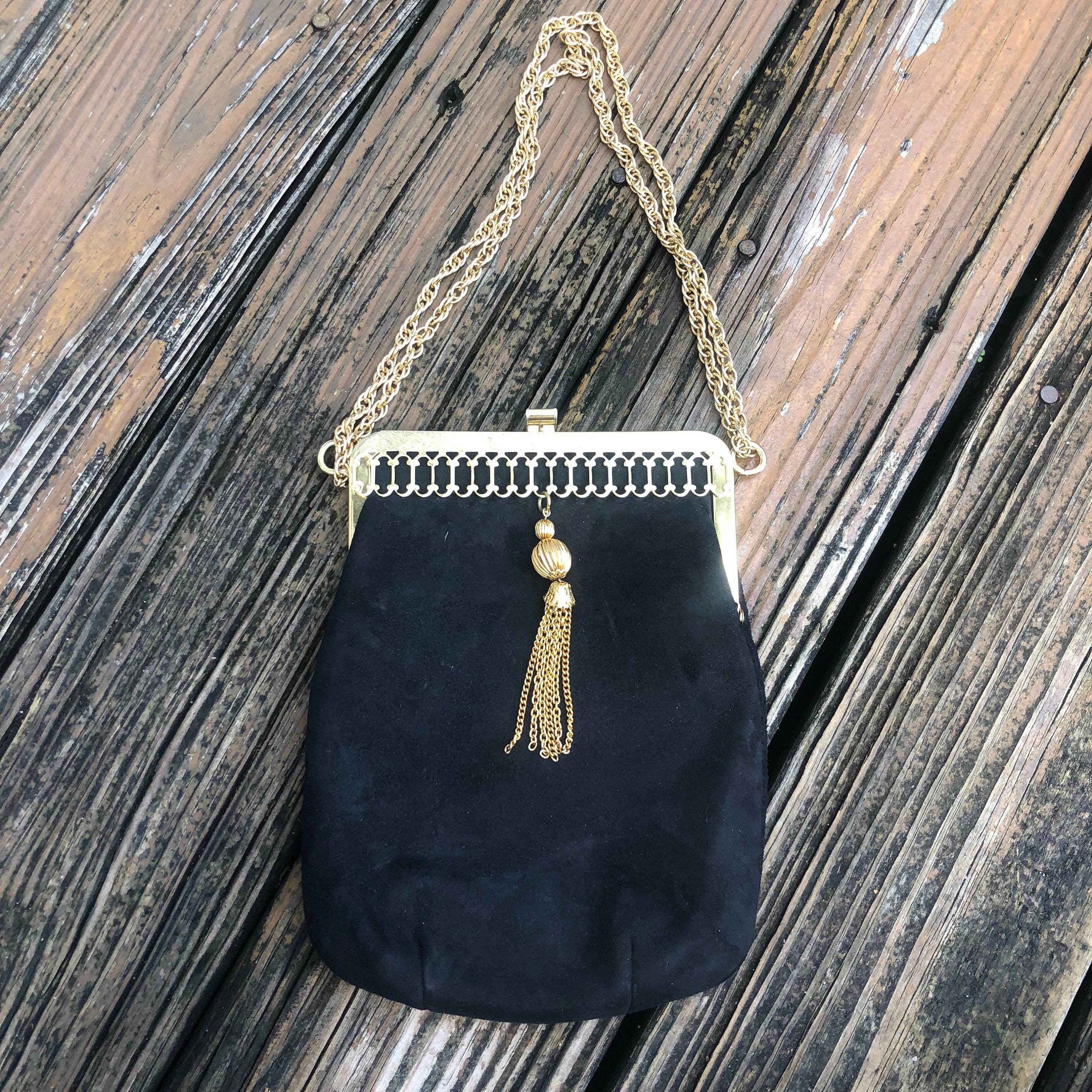black suede bag with gold chain