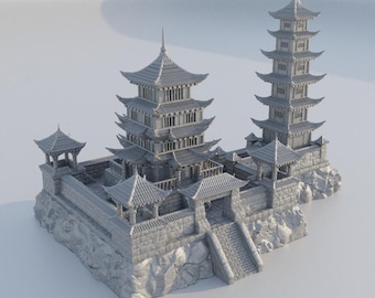 May include: A detailed, gray miniature of a traditional Japanese pagoda complex. The model features multiple tiered roofs, intricate architectural details, and is set on a rocky base with a staircase leading to a gate.