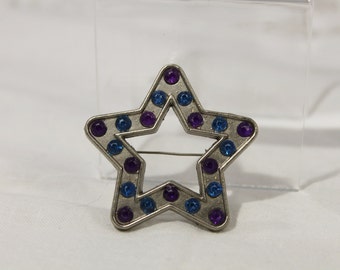 Open Star With Purple and Blue Plastic "Crystals" Pin / Brooch.