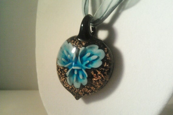 Glass pendant with flower inside deals