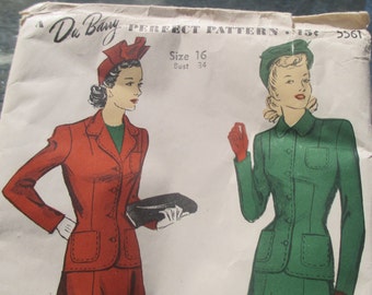 May include: Vintage sewing pattern for a women's suit. The pattern is for size 16, bust 34. The pattern shows two women wearing the suit in red and green. The pattern is from Du Barry Perfect Pattern and is priced at 15 cents.