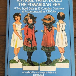 May include: Antique paper dolls from the Edwardian Era. The book features eight two-sided dolls and 32 complete costumes and accessories, all in full color. The dolls are dressed in various Edwardian-era fashions, including dresses, hats, and coats. The book is titled "Antique Paper Dolls: The Edwardian Era" and is produced by the Imagerie Pellerin at Epinal.