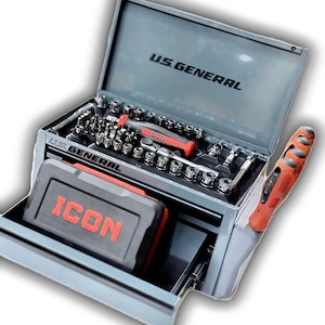 May include: A gray metal tool chest with the text "U.S. GENERAL" on the lid and "ICON" on a black and red toolbox. The open chest reveals various tools, including sockets, bits, and a red and black handled screwdriver.