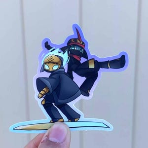 May include: A set of three ceramic mugs with a speckled, cream-colored glaze. Each mug features a different hand-painted floral design in shades of blue, green, and yellow. The mugs have a simple, rounded shape and a comfortable handle.