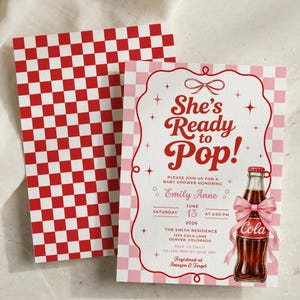 May include: A rectangular baby shower invitation card featuring a light pink and white checkered background, red text reading She's Ready to Pop!, and a graphic of a glass soda bottle with a pink bow. A matching red and white checkered envelope is included.