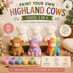 May include: A paint your own Highland cows craft kit featuring three unpainted white ceramic cow figurines and three painted figurines in brown, purple with white hearts, and rainbow colours. Includes six paint pots and a wooden paintbrush.
