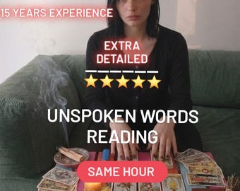 May include: A tarot reading setup featuring a colorful wooden table with tarot cards, a large amethyst cluster, a clear quartz point, a bowl of assorted polished gemstones, a black sphere, a lit candle, and a bundle of dried lavender and sage.
