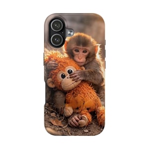 May include: A phone case featuring a heartwarming image of a baby monkey embracing an orange plush toy monkey. The case has a glossy finish and a camera cutout. The design captures a tender moment, perfect for animal lovers.