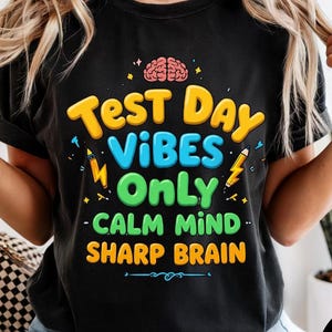 May include: A white ceramic mug with a black handle and the text "But First, Coffee" in a bold, black font. The mug is sitting on a wooden surface. The mug is approximately 4 inches tall.