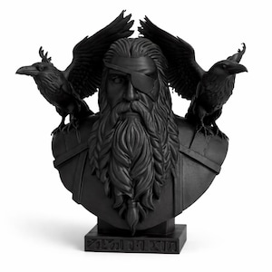 May include: Black bust sculpture of a bearded man with an eye patch, flanked by two ravens with outstretched wings. The sculpture is on a rectangular base with engraved text. The bust is a decorative item.