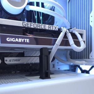 May include: A white computer case interior with a Gigabyte GeForce RTX graphics card. White tubing and a CPU cooler are visible. The text "GIGABYTE" and "GEFORCE RTX" are displayed on the graphics card.