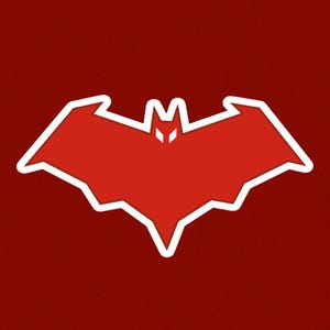 May include: A red bat-shaped emblem with a white outline, featuring a stylised bat silhouette with pointed ears and wings, set against a solid dark red background. The design is symmetrical and features two small white triangular eye cutouts.