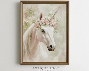 May include: A framed print featuring a white unicorn adorned with a floral crown. The unicorn has a long, spiraled horn, set against a soft, pastel background. The text "ANTIQUE ROOT PRINTS" is at the bottom of the print.