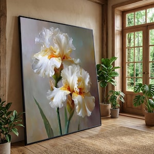 May include: A large rectangular framed wall art piece featuring a detailed painting of two white and pale yellow iris flowers with green stems. The artwork is set against a soft, neutral-toned background with visible brushstrokes and light shading.
