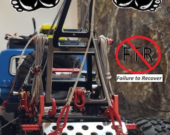 May include: A detailed view of a model off-road vehicle winch system. The winch features red hooks, a black frame, and gray ropes. The image includes the text "FTR Failure to Recover" inside a red circle, and two black footprints.