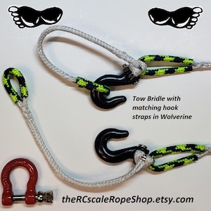 May include: Tow bridle with matching hook straps in Wolverine. The image shows a tow bridle with black hooks and a red shackle. The straps have a black and neon green pattern. The text "theRCscaleRopeShop.etsy.com" is visible.