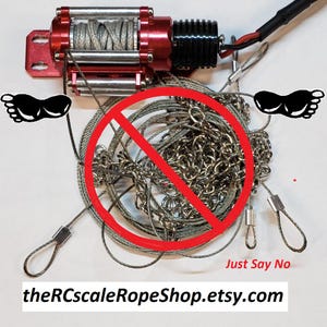 May include: A red and black winch with a silver cable and chain. The image includes the text "Just Say No" and the Etsy shop URL.