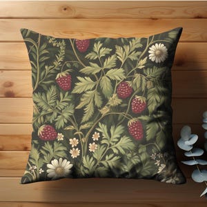 May include: Square throw pillow with a dark background featuring a botanical design of strawberries, green leaves, and white daisy-like flowers. The pillow has a vintage, floral pattern.