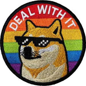 May include: Embroidered patch featuring a Shiba Inu dog wearing pixelated sunglasses. The dog is set against a rainbow background with the words "DEAL WITH IT" in white lettering. The patch has a black border.