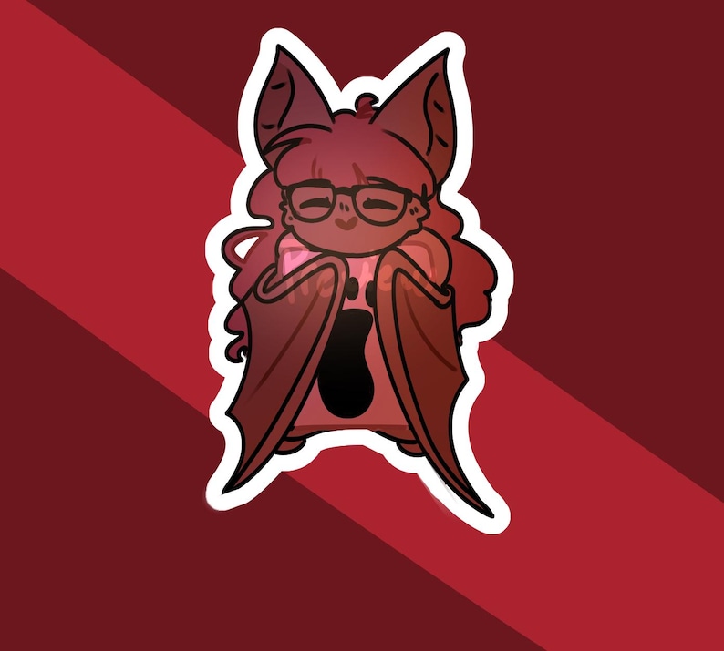 May include: A sticker featuring a cartoon bat character with glasses, wings, and a paw print on its chest. The bat is in shades of red and brown, with a white outline. The background is a diagonal red and maroon pattern.