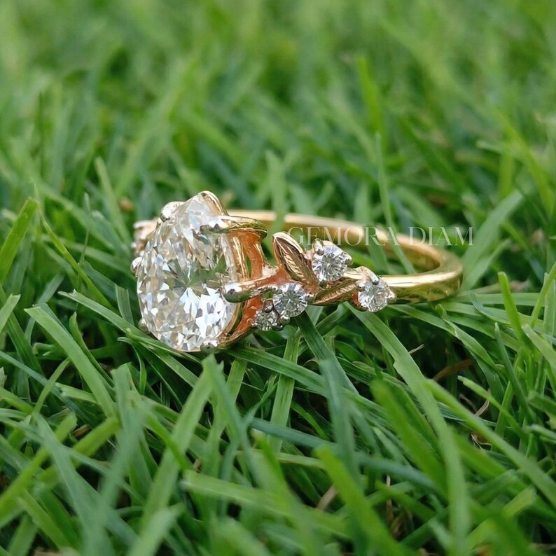 Side view of 10k solid gold ring showing a 2mm tapered band and secure multi-prong setting height for a pear-shaped center stone.