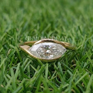 Marquise lab grown diamond engagement ring in 14k solid gold bypass bezel setting, F color VS clarity, modern bridal jewelry.
