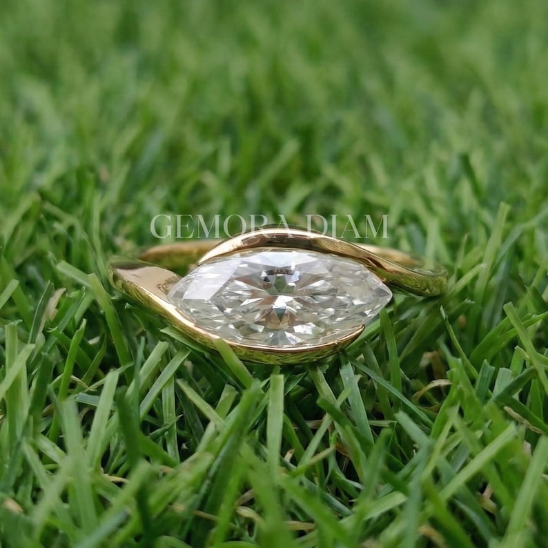 Marquise lab grown diamond engagement ring in 14k solid gold bypass bezel setting, F color VS clarity, modern bridal jewelry.