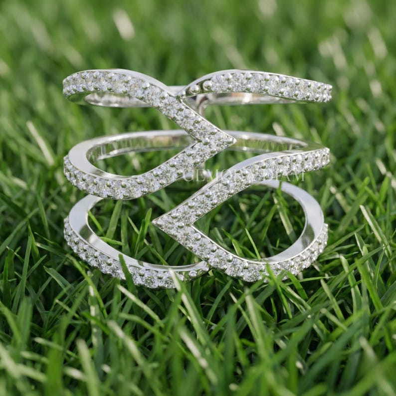 Modern multi-row wide band ring in 14k white gold featuring round lab grown diamonds in a geometric pave setting.