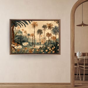 May include: A framed watercolor painting of a tropical landscape featuring palm trees, lush greenery, and flowers. The artwork has a warm color palette with shades of beige, brown, and green. The painting is displayed on a white wall in a room with wooden floors.