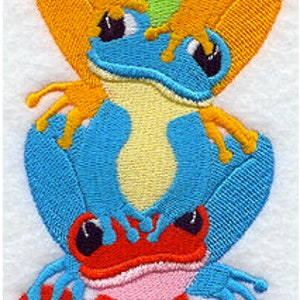 May include: A stack of three embroidered frogs, each a different color. The top frog is orange, the middle frog is blue, and the bottom frog is red.