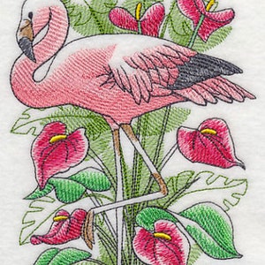 May include: Pink flamingo standing on one leg in a lush green tropical plant with red flowers.
