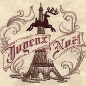May include: Embroidered design featuring the Eiffel Tower, a reindeer, and the text "Joyeux Noël" on a cream-colored fabric. The design uses brown and burgundy thread, with ornate scrollwork surrounding the central elements.