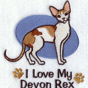May include: Embroidered design of a brown and white Devon Rex cat with the text "I Love My Devon Rex" and paw prints.