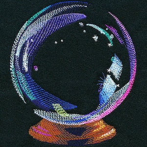 May include: A colorful, embroidered glass orb with a swirling design. The orb is on a small, orange base.