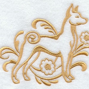 May include: Gold embroidered design of a dog with floral accents on a white background. The dog is stylized with a long neck and tail, surrounded by swirling floral patterns and small flowers. Suitable for decorative items or textiles.