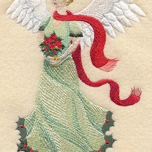 May include: Embroidered angel with white wings, a red scarf, and a green dress holding a bouquet of red flowers. The angel's dress is trimmed with holly leaves and berries.
