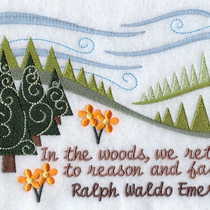 May include: Embroidered artwork featuring stylized evergreen trees, orange flowers, and blue sky with clouds. The text "In the woods, we return to reason and faith. Ralph Waldo Emerson" is stitched below the landscape.