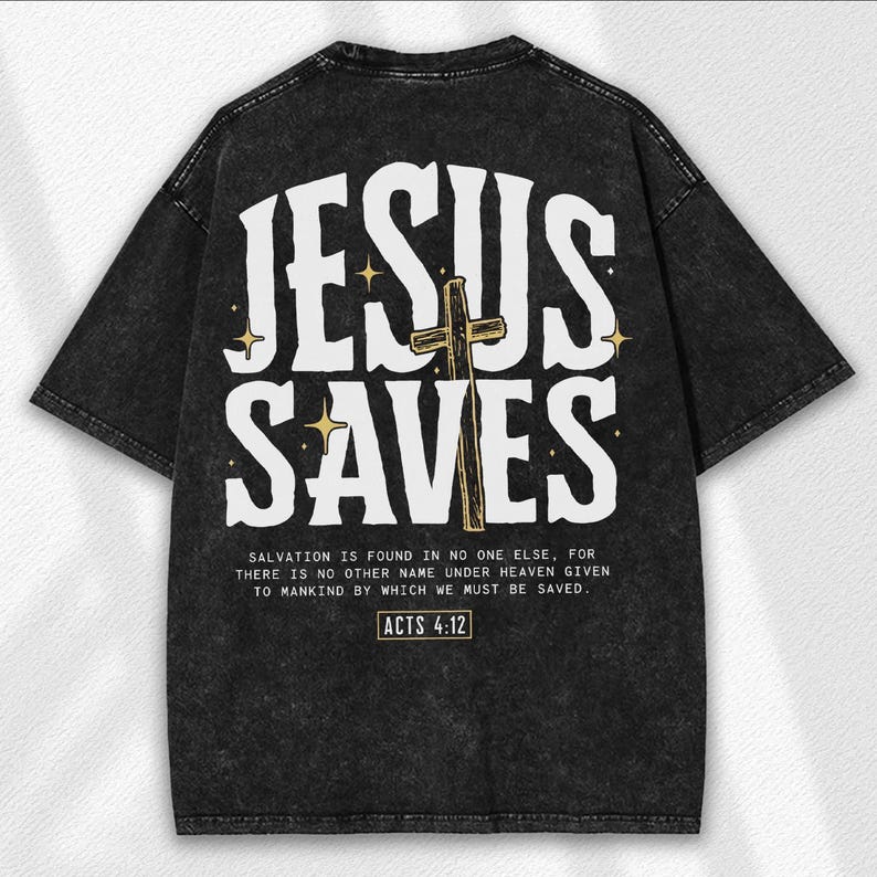 May include: Black t-shirt with the text "JESUS SAVES" in white, featuring a gold cross and stars. Below the text is a quote from Acts 4:12. The shirt has a vintage, distressed look.