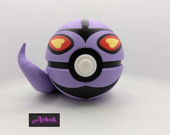 May include: A 3D-printed purple and black spherical figure with a white button and a curved tail. The figure has red and yellow eye details. The word "Arbok" is printed on a black rectangle.