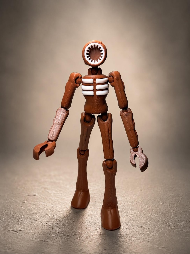May include: A brown Siren Head action figure with a speaker-like head and articulated limbs. The figure has white rib detailing and claw-like hands, standing on a neutral background. The toy is a collectible item.