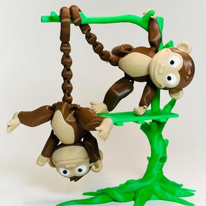 May include: A set of three ceramic mugs with a speckled, matte finish. The mugs are in shades of cream, light gray, and dark gray. Each mug has a simple, minimalist design and a rounded handle.