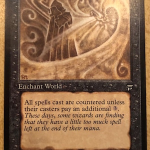 May include: A rectangular trading card titled Nether Void with a black border and a brown illustration of a cloaked figure. The text reads: Enchant World, All spells cast are countered unless their casters pay an additional 3. Illus: 1994 Harold McNeill.