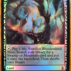May include: A holographic trading card titled Bloodstained Mire featuring a dark, abstract landscape illustration. The card text reads: Tap, Pay 1 life, Sacrifice Bloodstained Mire: Search your library for a Swamp or Mountain card and put it onto the battlefield. Then shuffle your library.